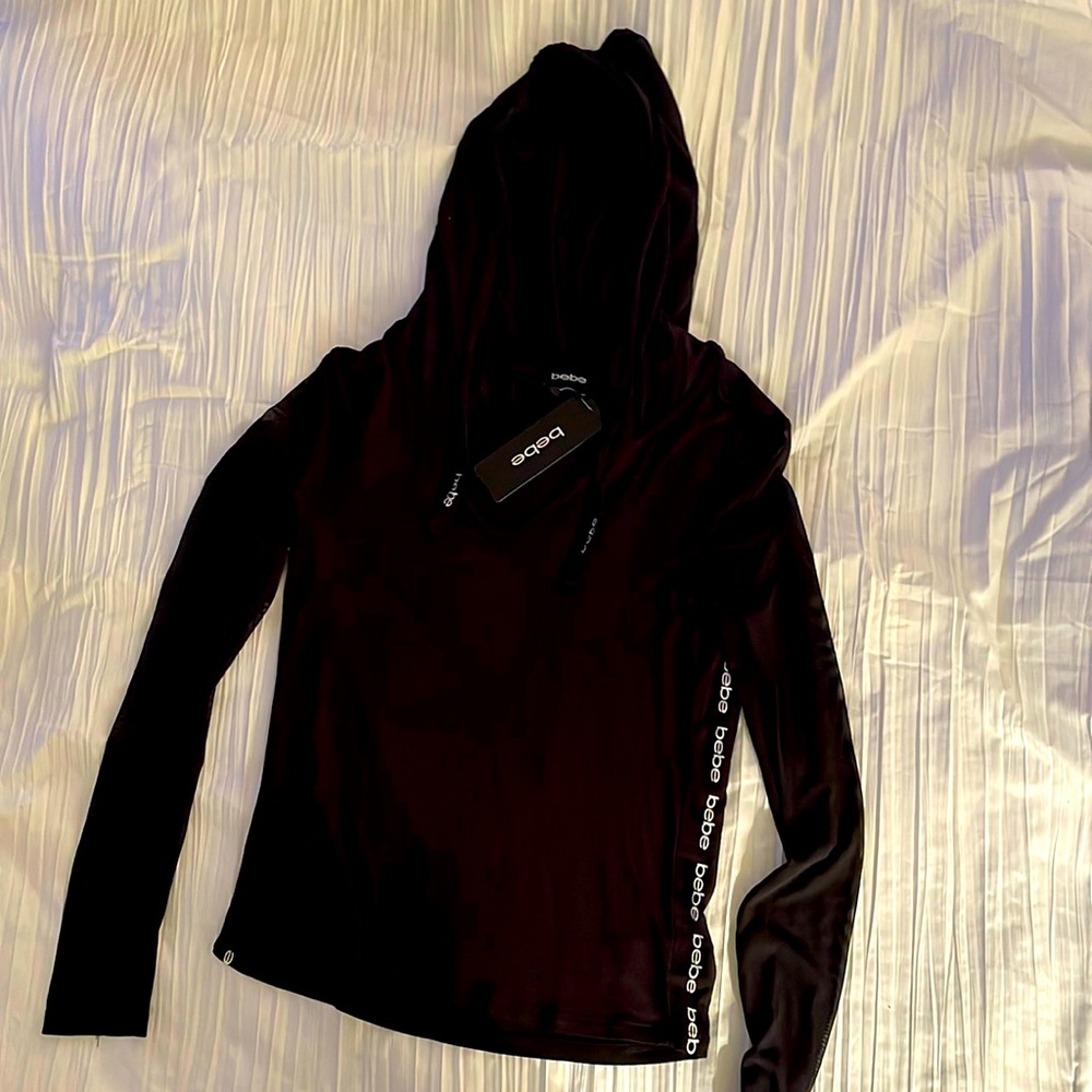 Bebe lightweight hooded top. V neck. Black. Sz M. Brand new with tag. Shear arms